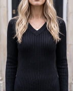 Women's V-Neck Ribbed Mini Sweater Dress in Black — V-neck detail