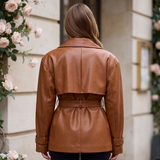 Women's Belted Faux Leather Short Trench Jacket in Brown – back on model