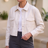 White cropped faux leather shirt jacket — relaxed lifestyle view