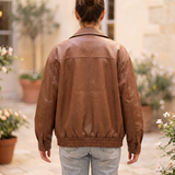 Women's Oversized Faux Leather Zip-Up Bomber Jacket — Light Brown — rear on model