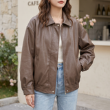 Women's Relaxed Faux Leather Bomber Jacket with Welt Pockets — Brown — front on model