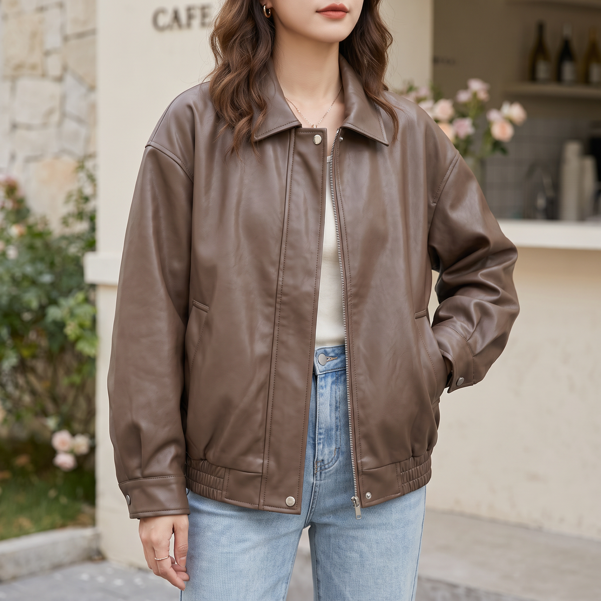 Women's Relaxed Faux Leather Bomber Jacket with Welt Pockets — Brown — front on model