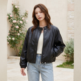 Women's Stand-Collar Faux Leather Bomber Jacket with Drawcord Hem — Black — alternate front view